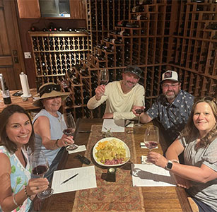 Guests seated for a private tasting in the Aum Cellars cellar